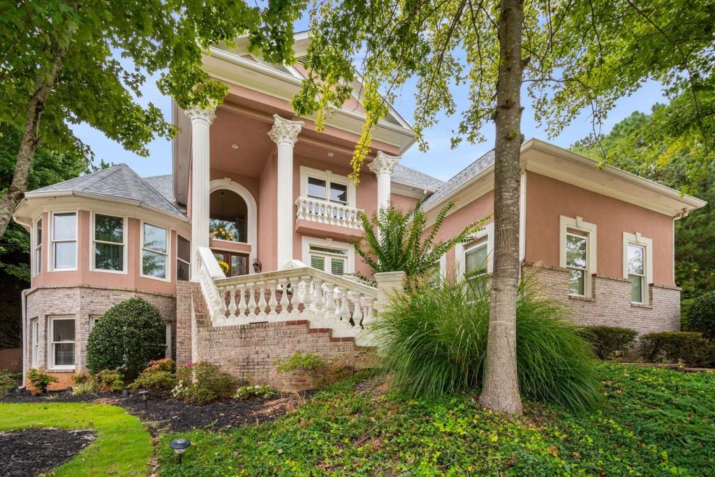 a front view of a house with garden