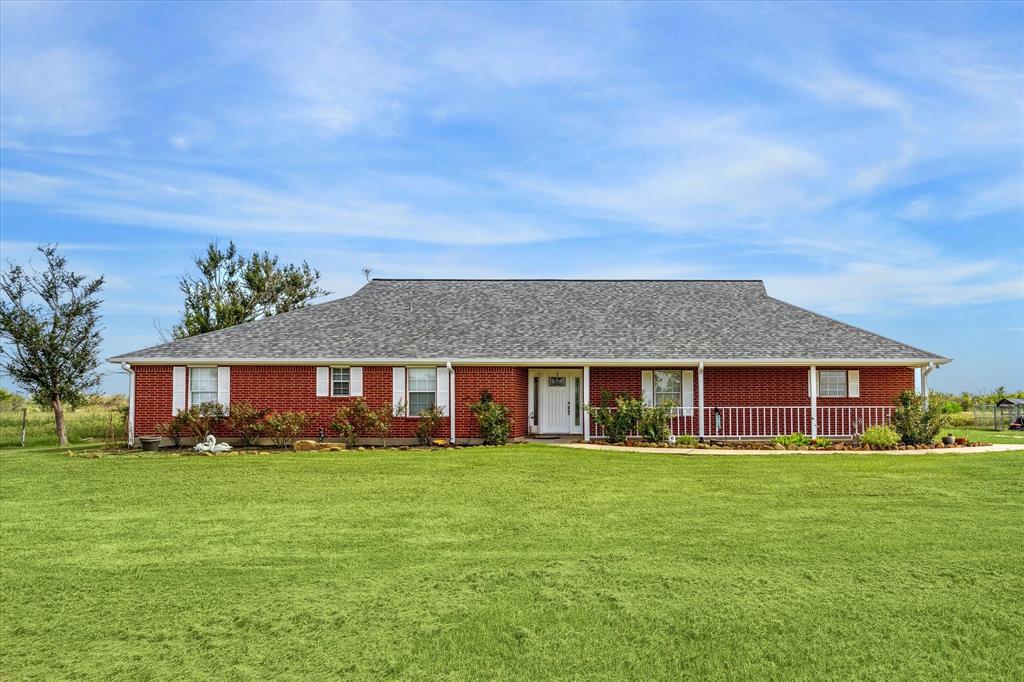 front view of a house with a yard