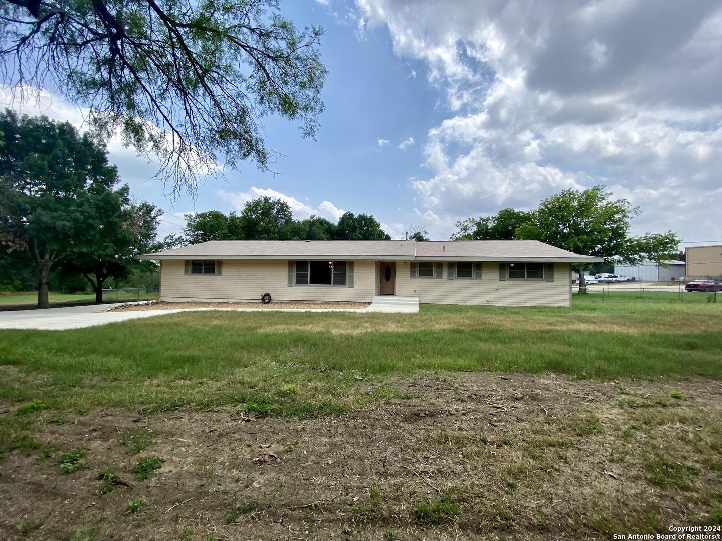 a view of a house with a yard