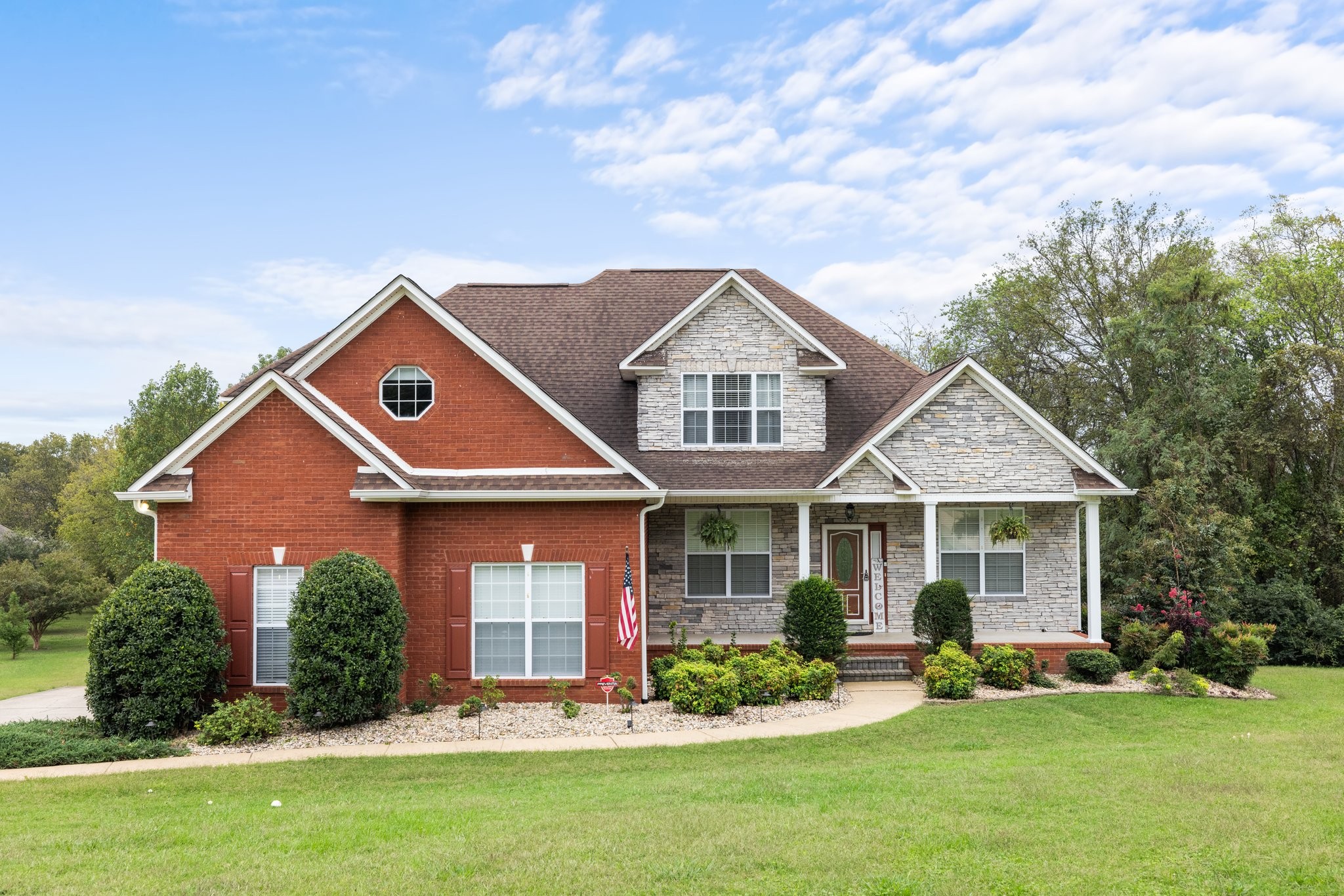 front view of a house with a yard