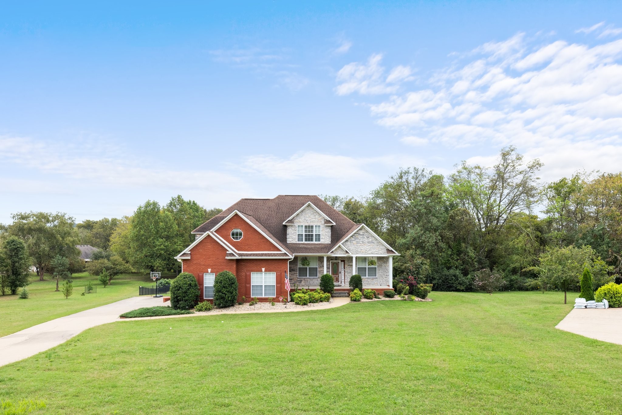 a front view of a house with garden