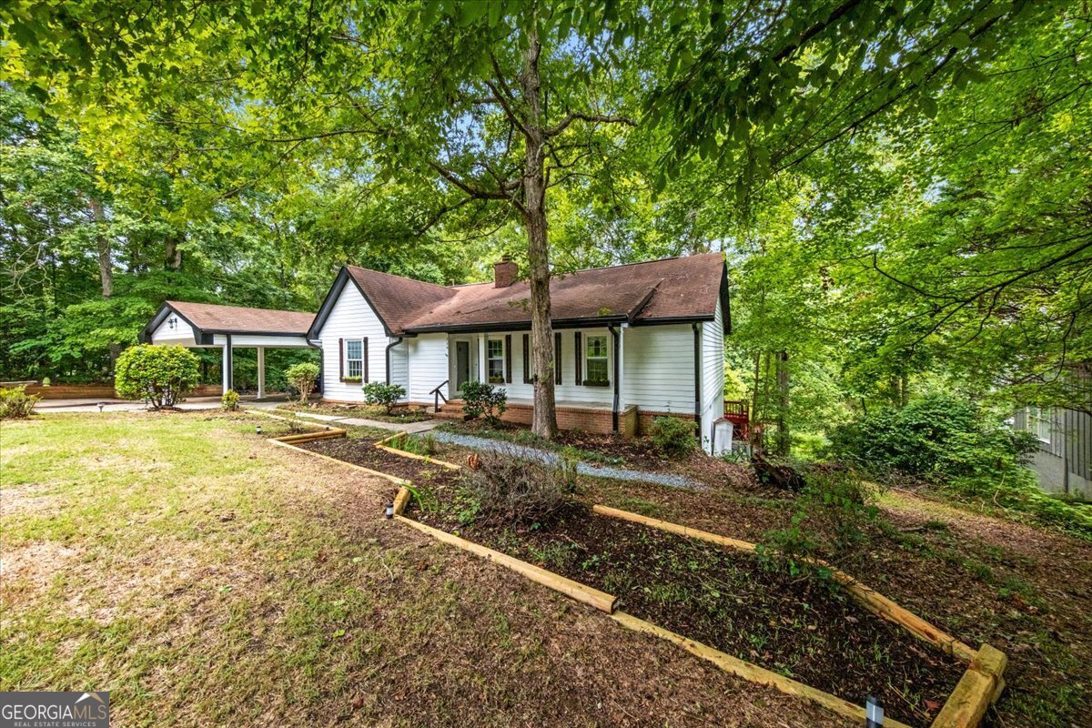 a front view of a house with garden