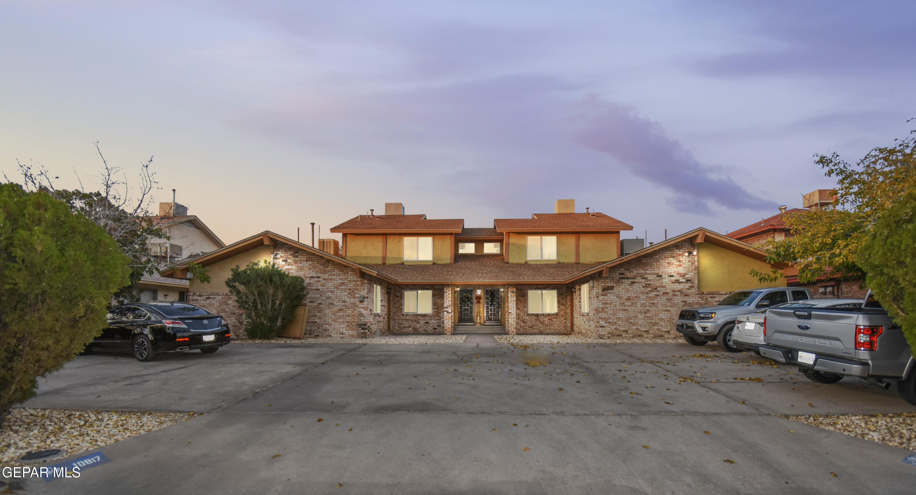 a view of a car park in front of house