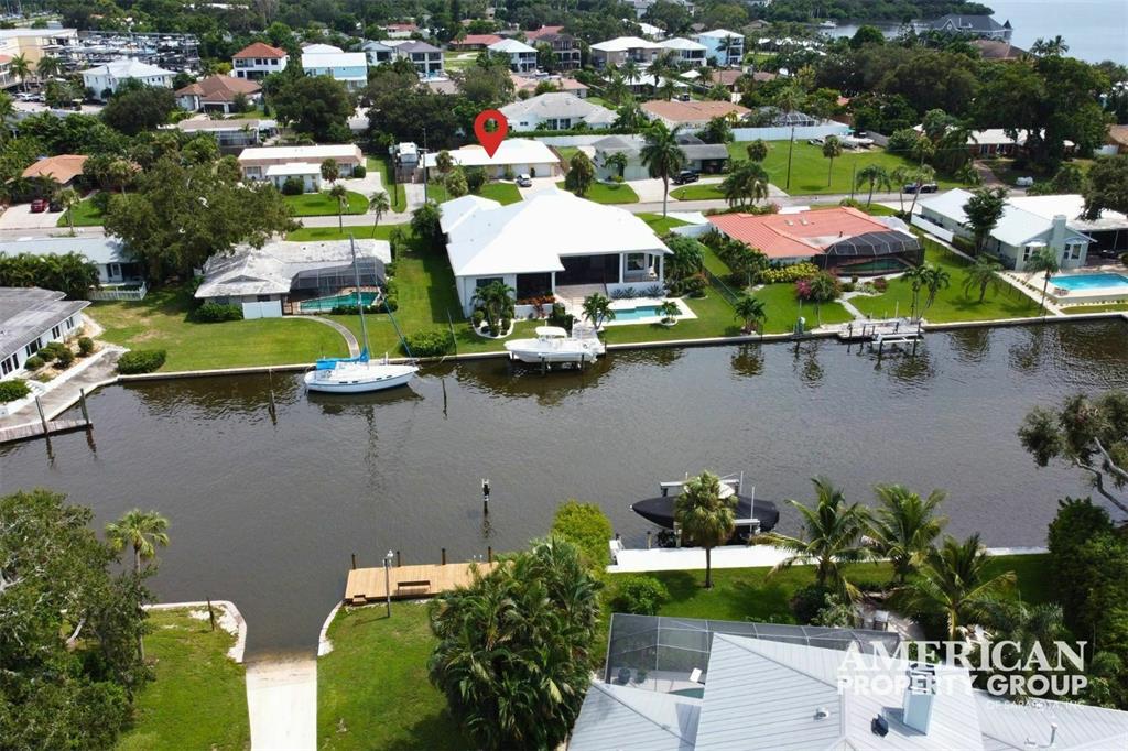 an aerial view of a house with a lake view