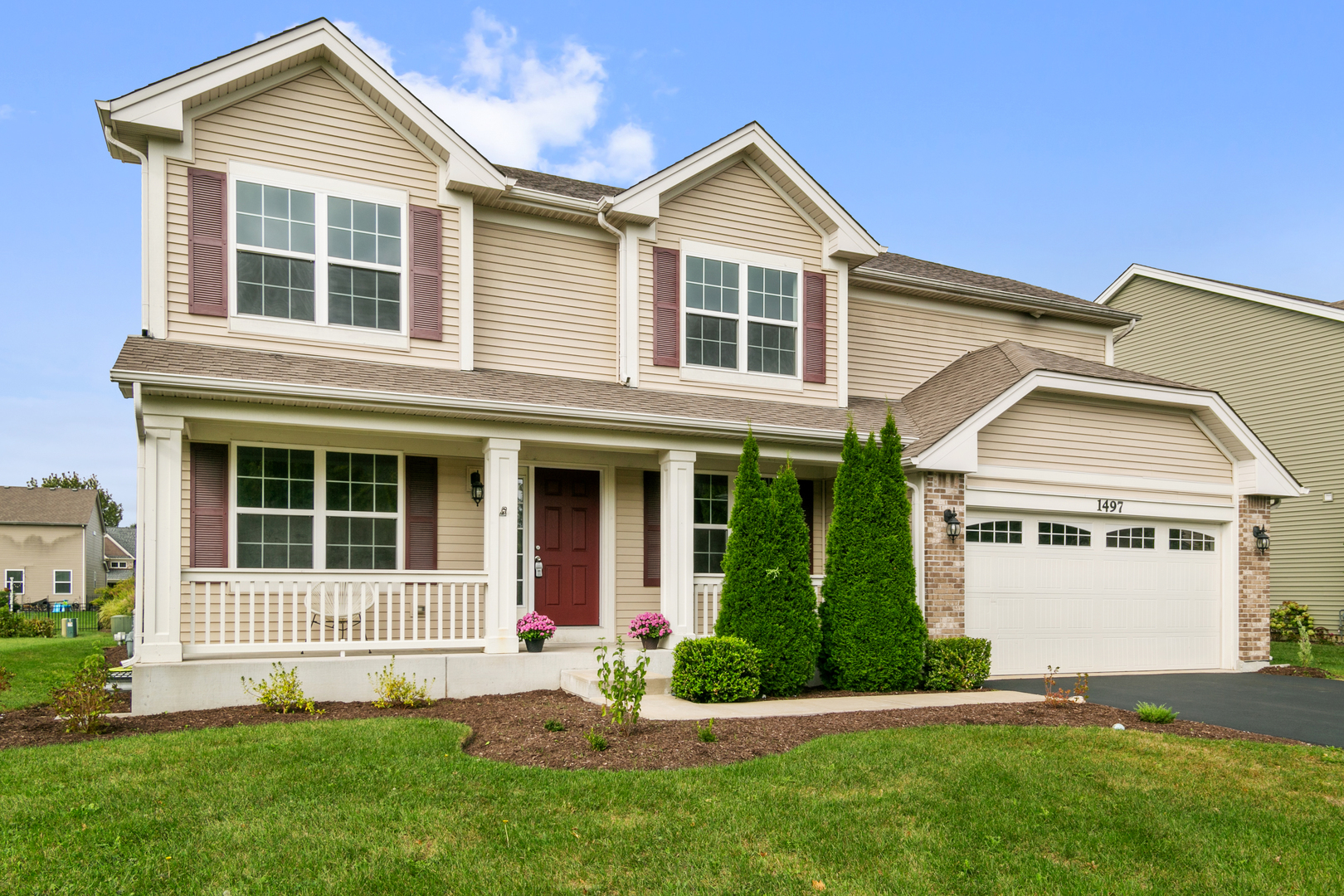 a front view of a house with a yard