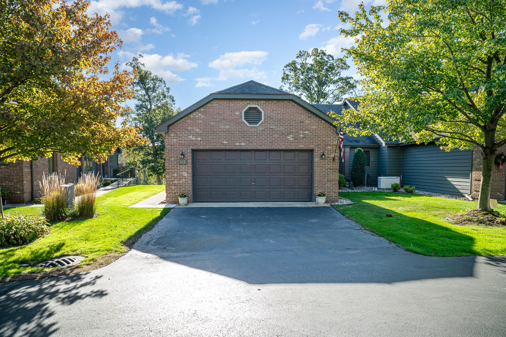 a front view of house with yard and green space