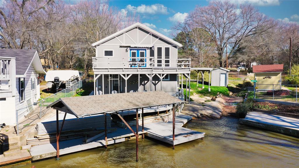 a aerial view of a house with swimming pool and porch