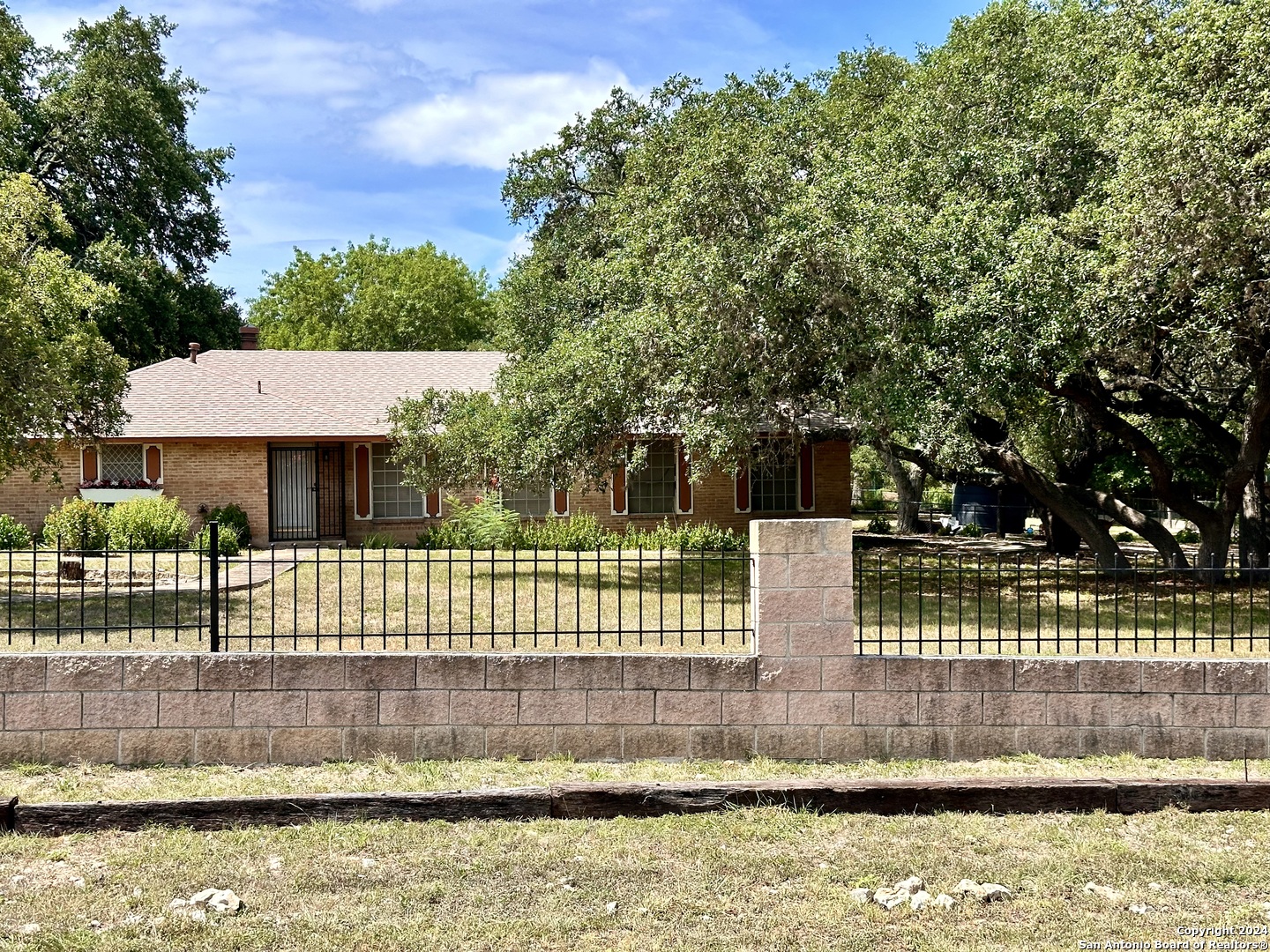 a view of house with a swimming pool