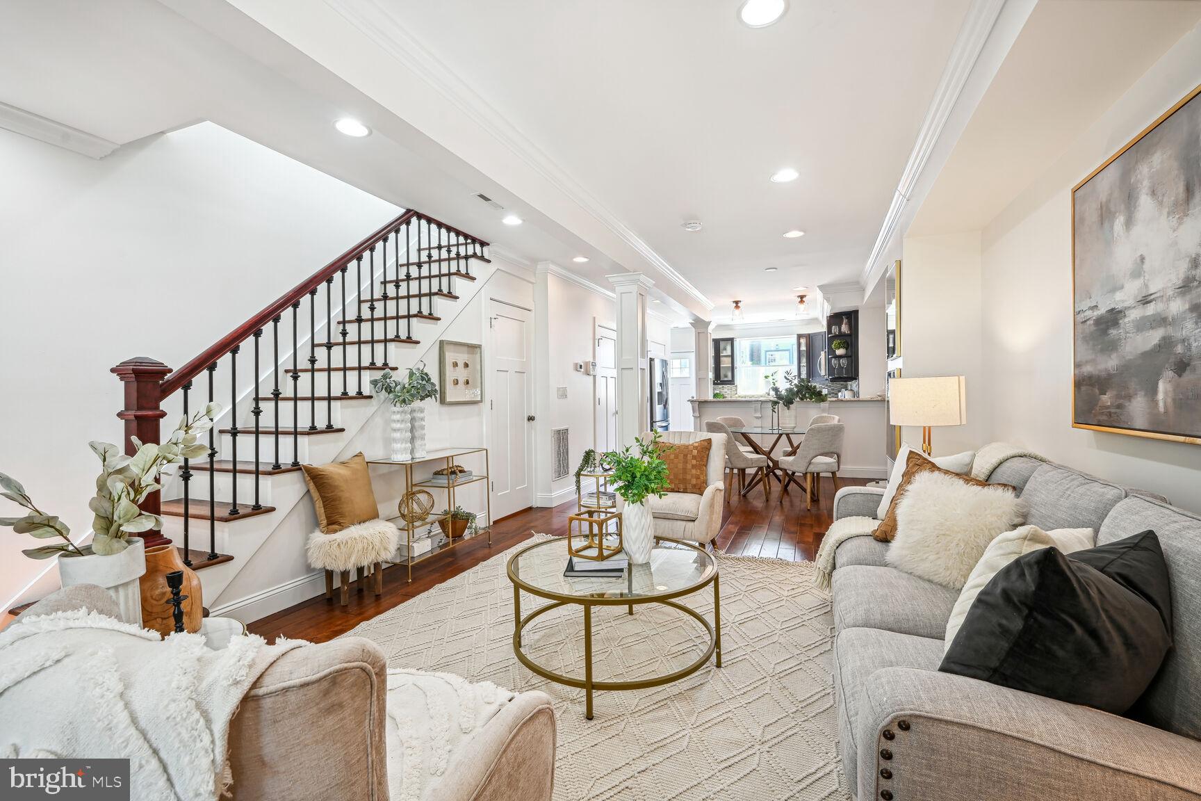 a living room with furniture and white walls