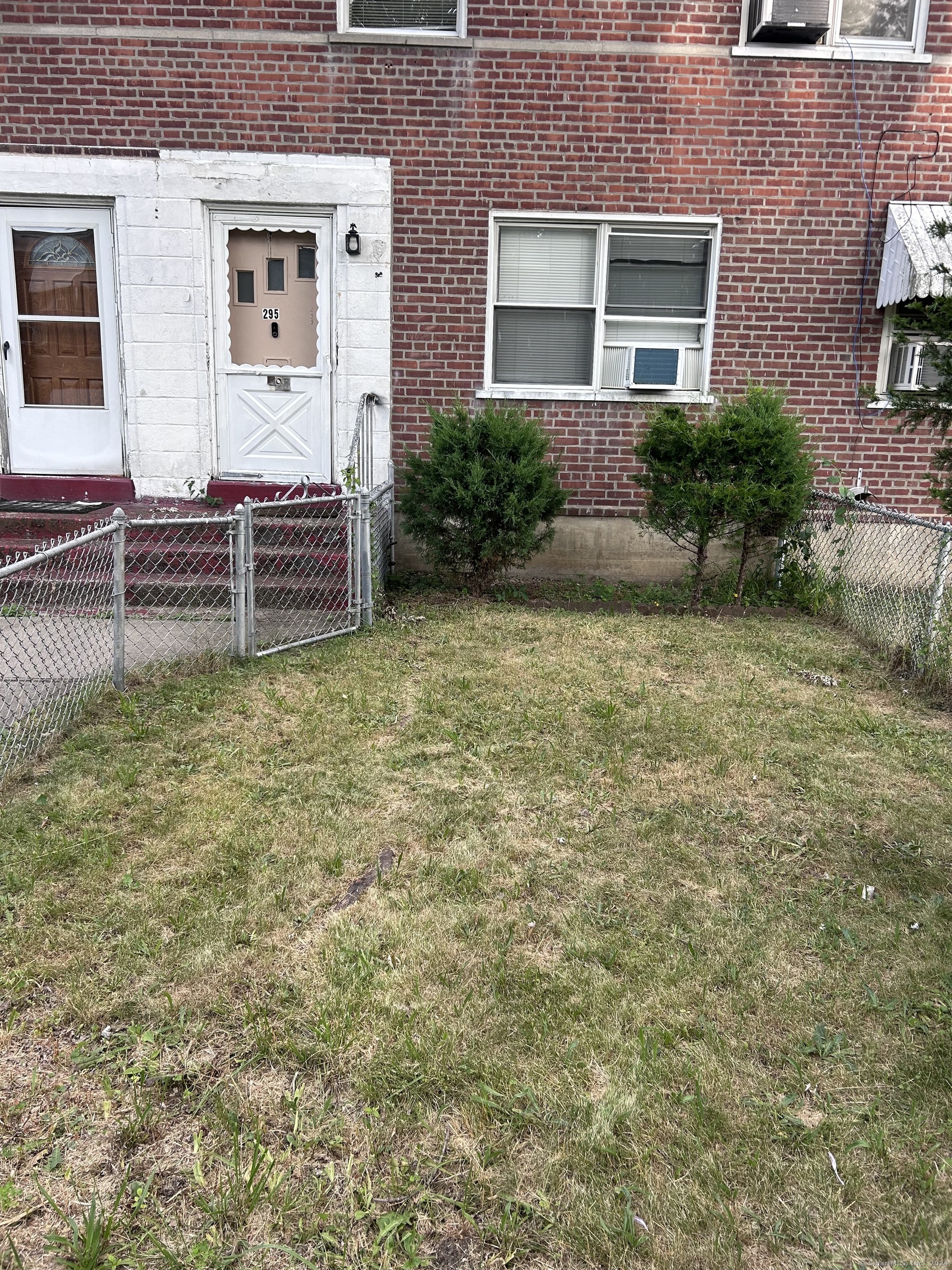 a view of front door of house with yard