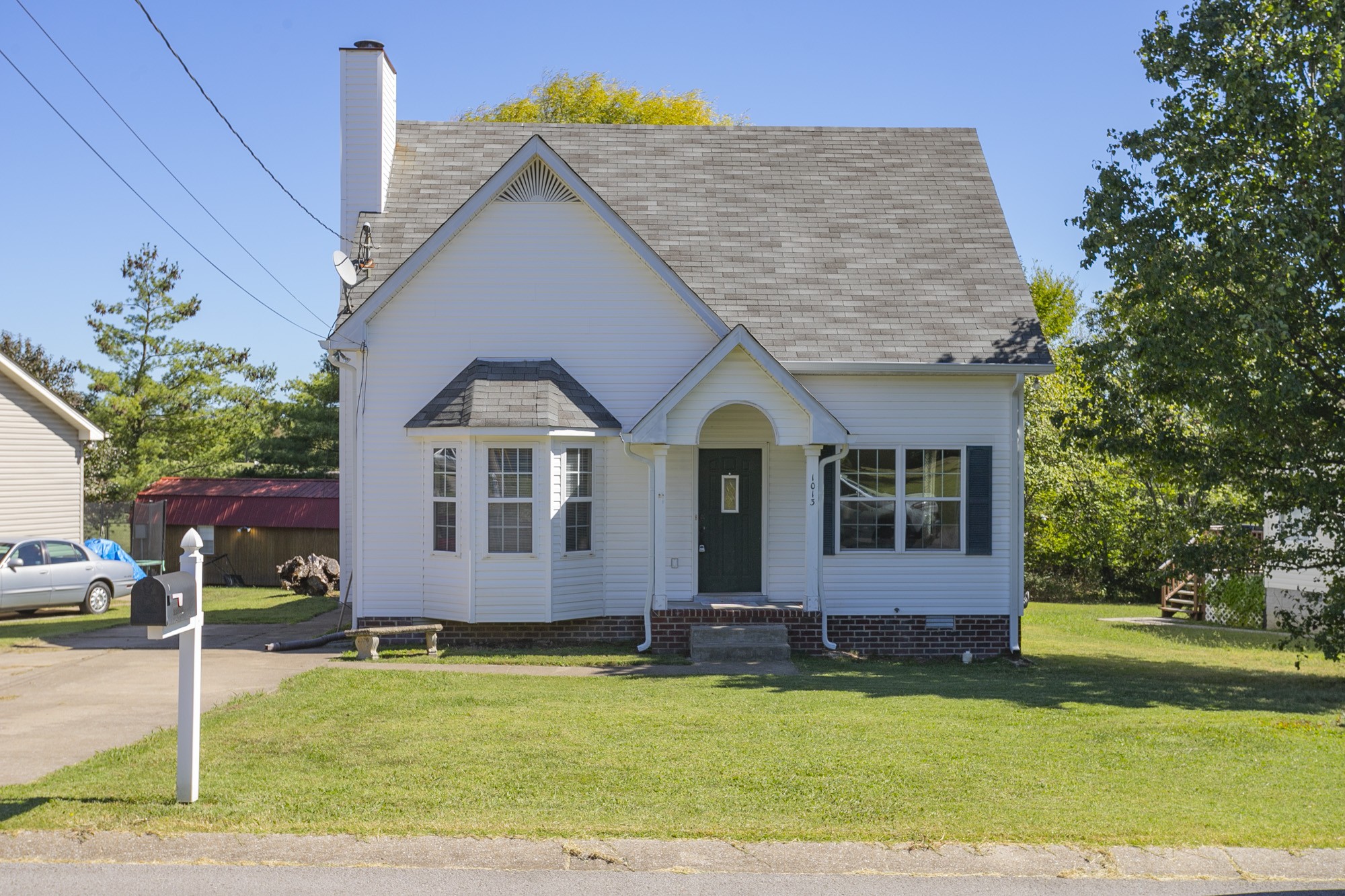 front view of a house with a yard