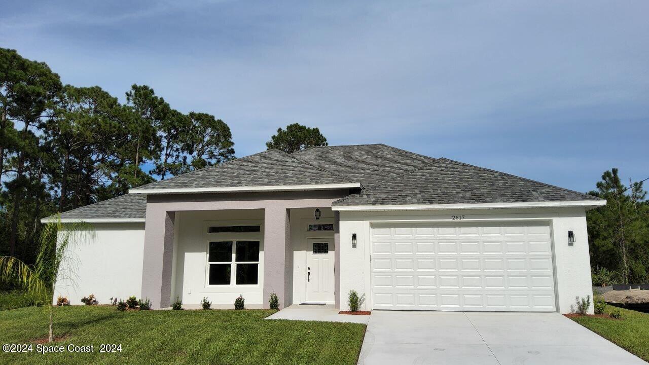 front view of a house with a yard