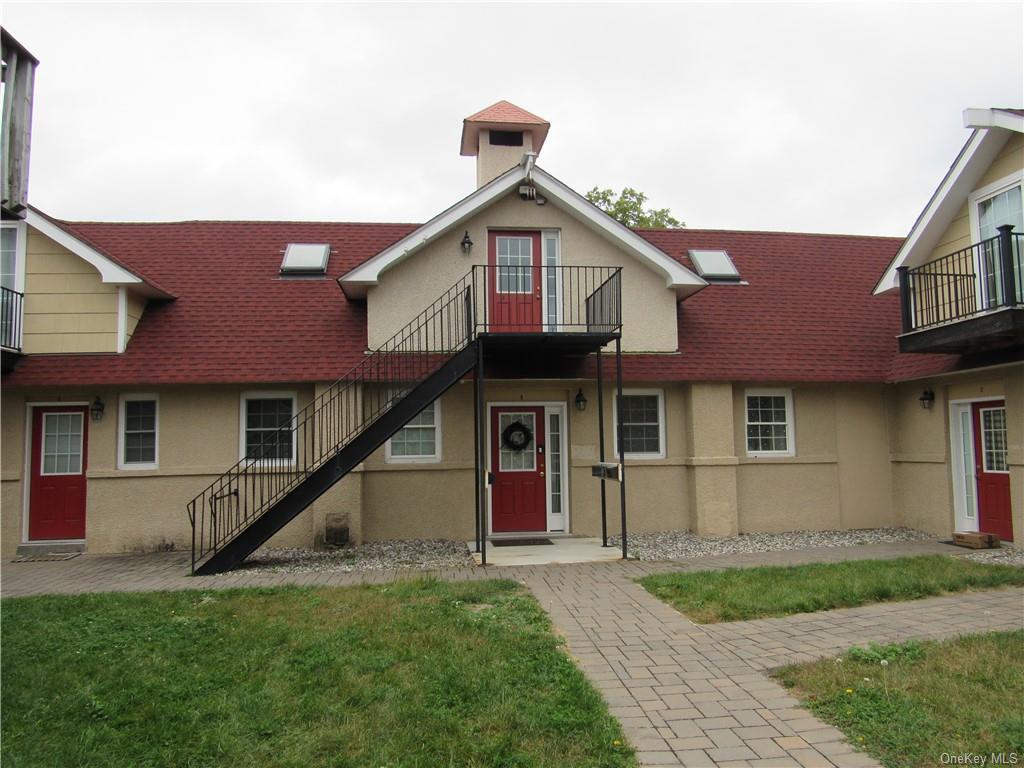 View of front of property. Unit#F is on 2nd Floor.