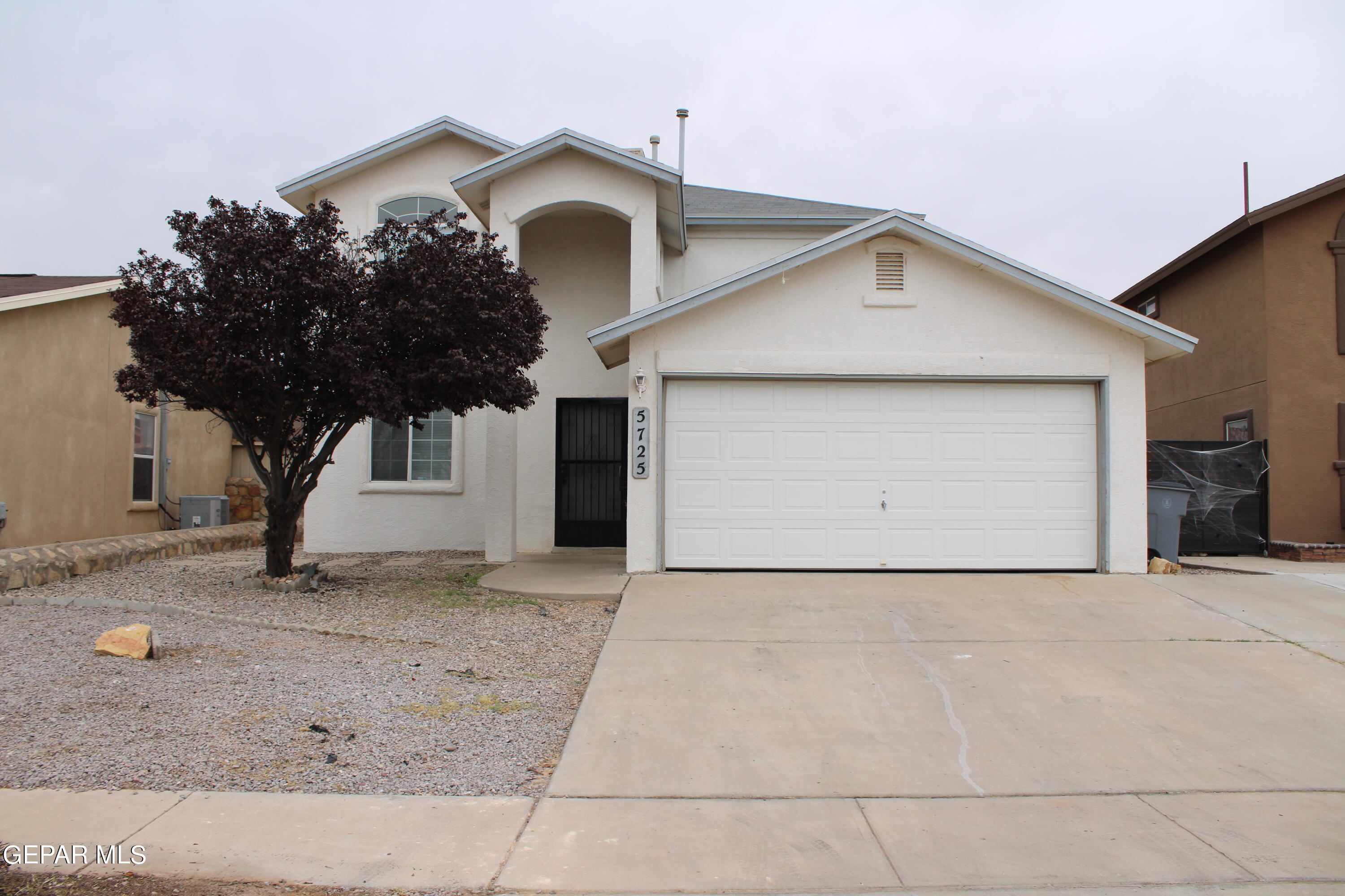 a view of a house with a garage