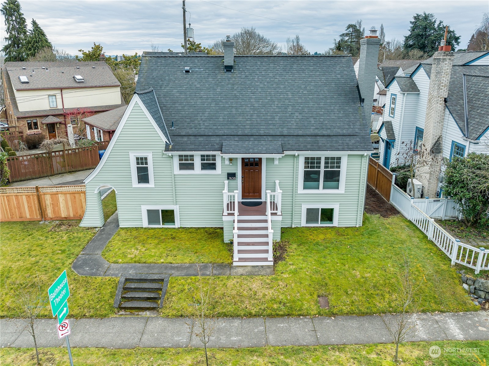 a view of a house with a backyard