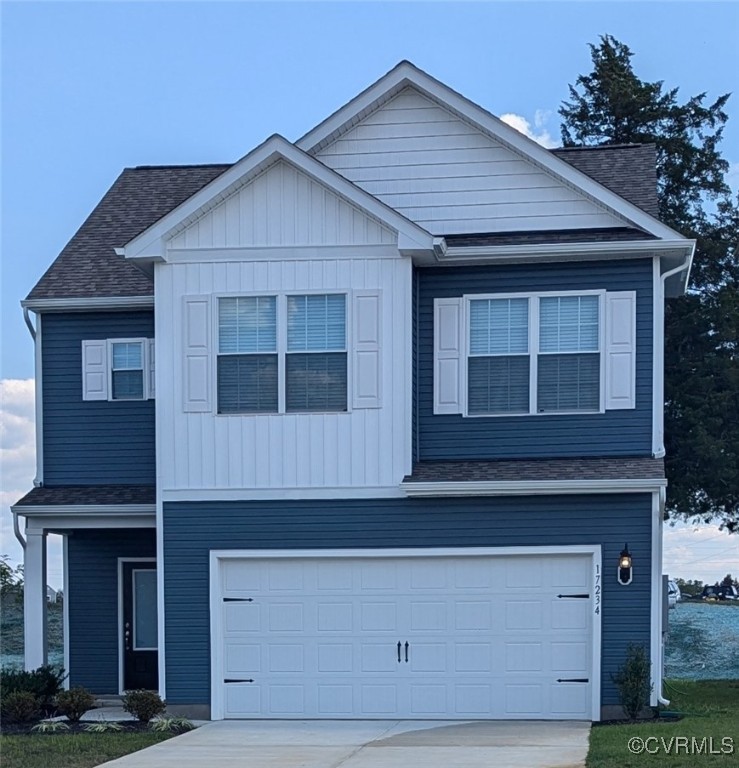 a front view of a house with garage