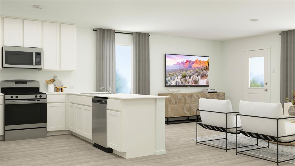 a kitchen with furniture cabinets and stainless steel appliances