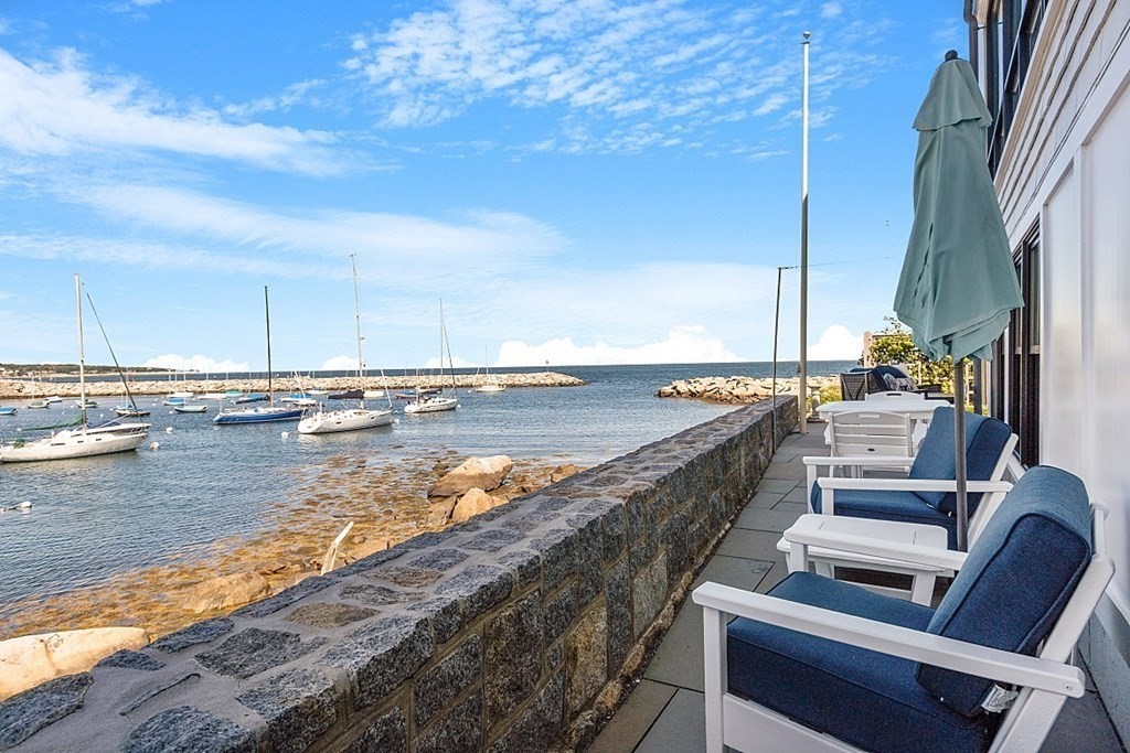 a view of swimming pool with outdoor seating