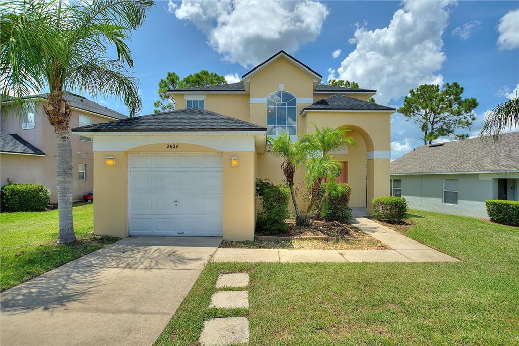 a front view of a house with a yard