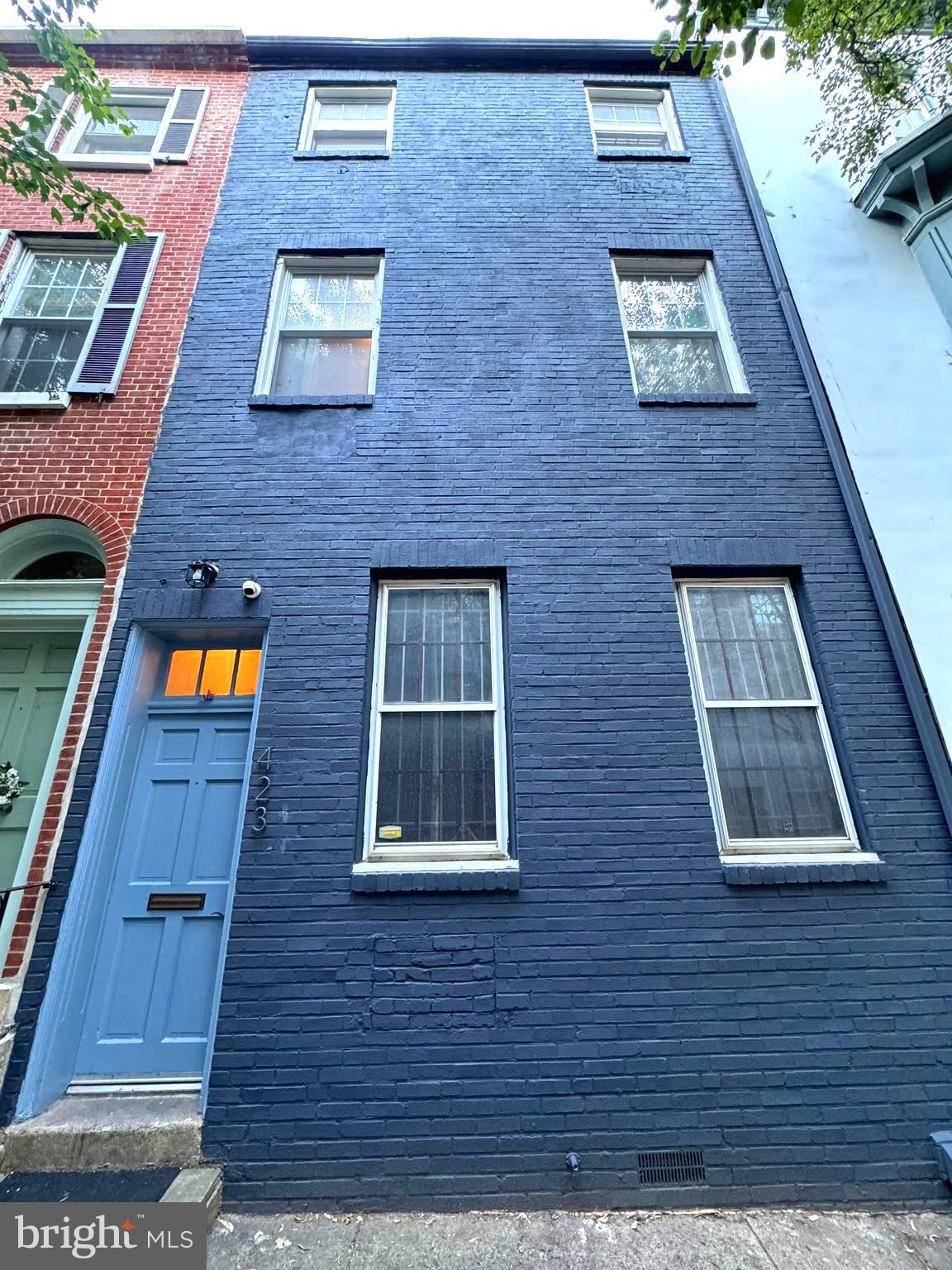 a brick building with a lots of windows on it