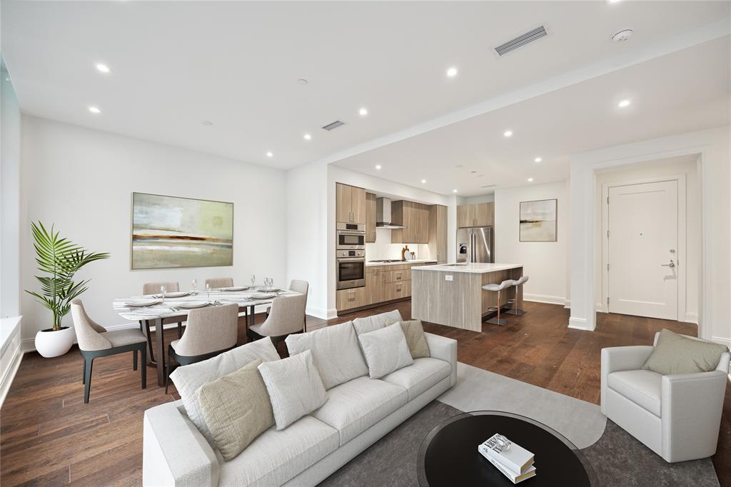 Modern, open-concept Living/Dining/Kitchen space features bright, natural sunlight, engineered hardwood floors and a wonderful flow.  The kitchen has Italian wood style cabinetry plus a breakfast bar.