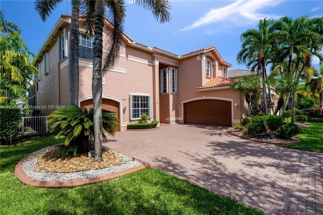 a front view of house with yard and entertaining space