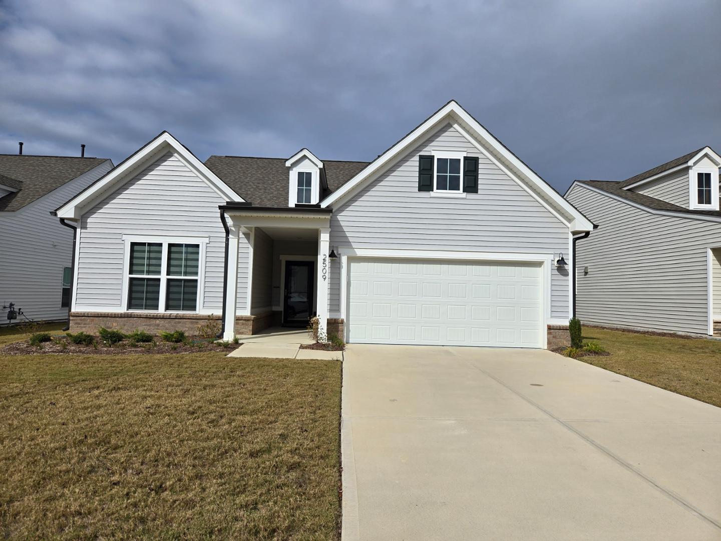 a front view of a house with yard