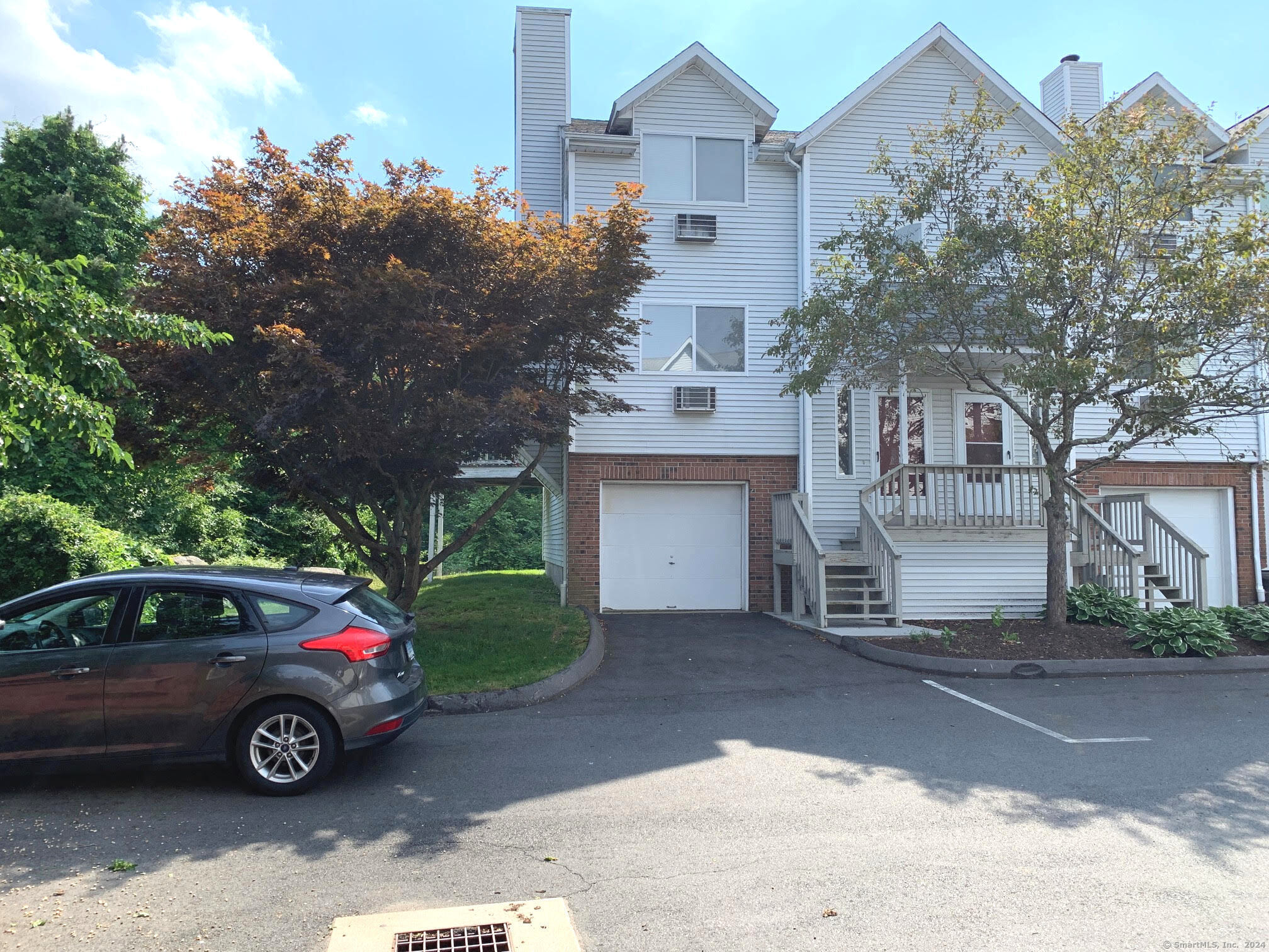 a car parked in front of a house