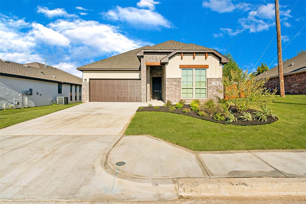 a view of a big house with a yard