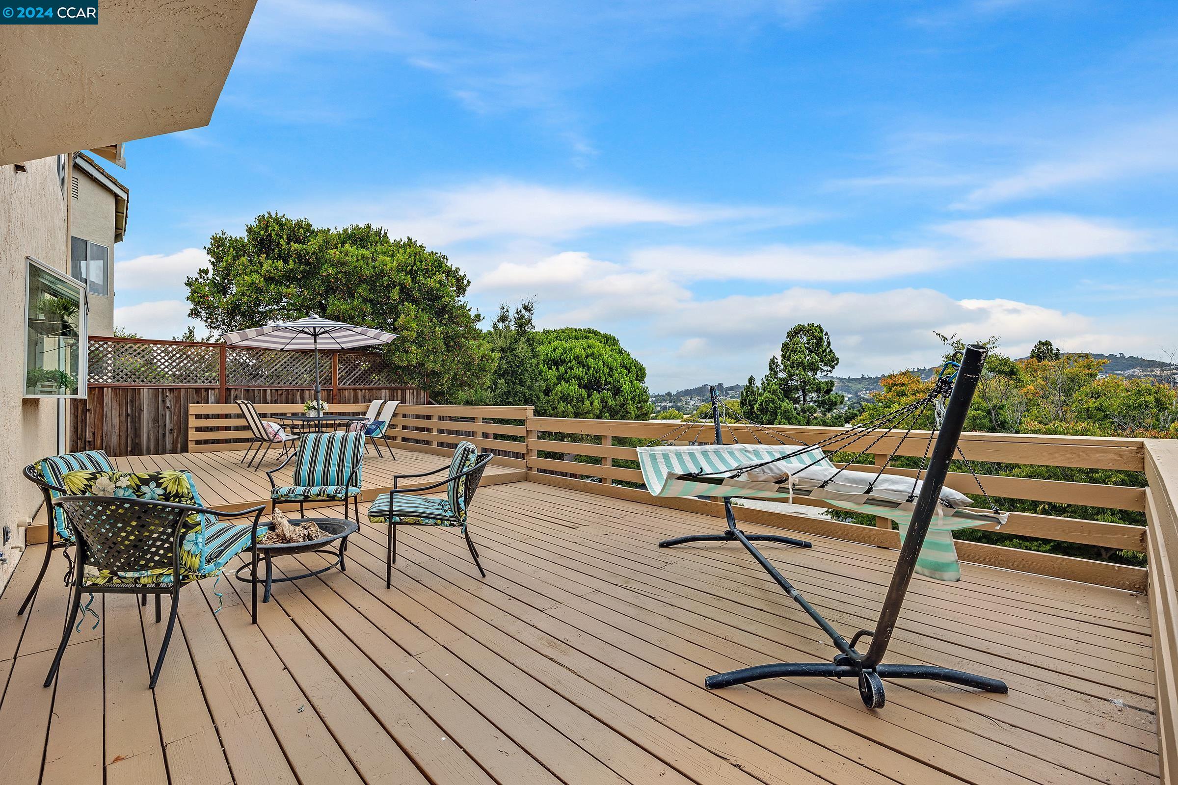 a view of a chairs on the roof deck