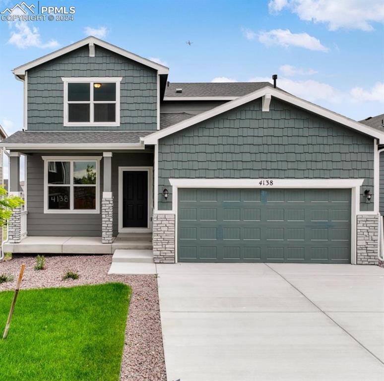 Craftsman house featuring a garage