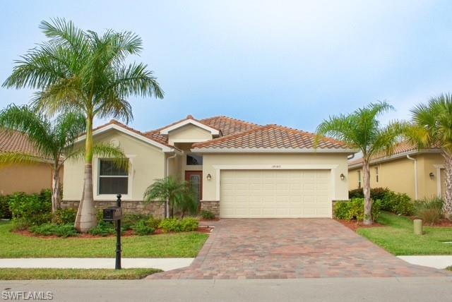 a front view of house with garage and yard