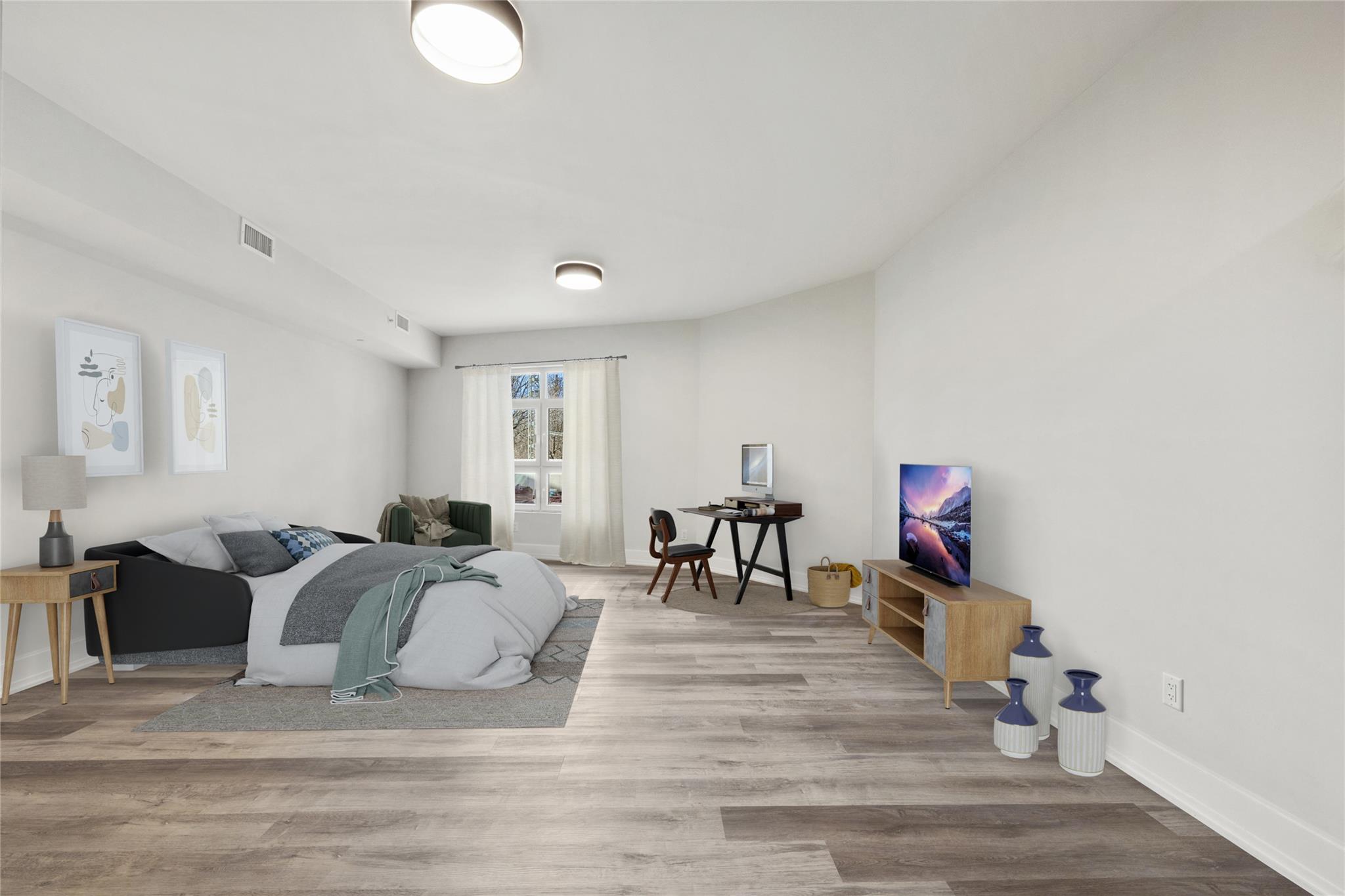 Bedroom with light wood-type flooring