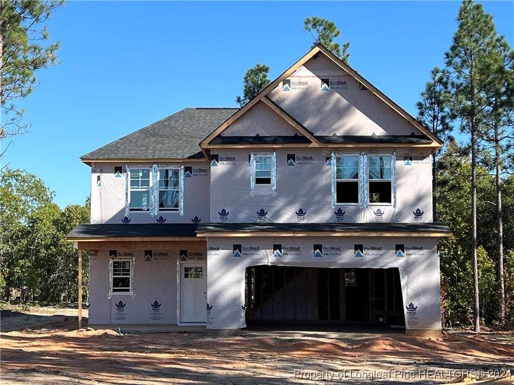 a view of a house with a grill and a fireplace