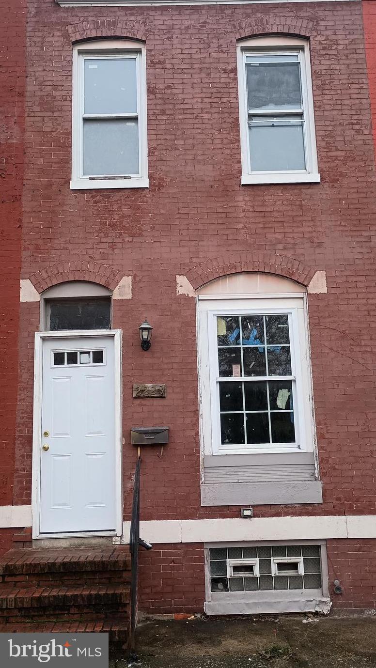 a front view of a house with large windows