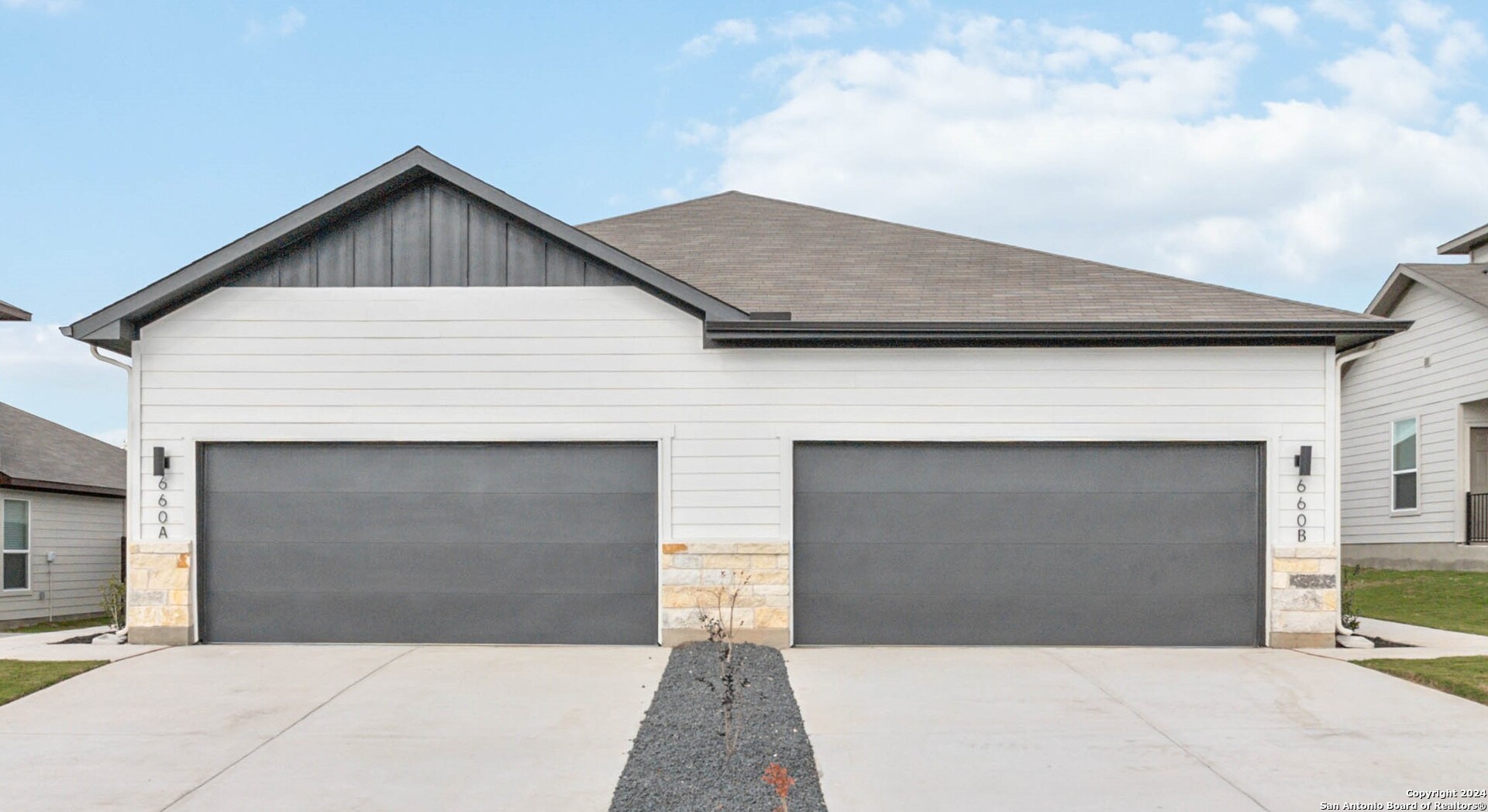 a view of house with garage