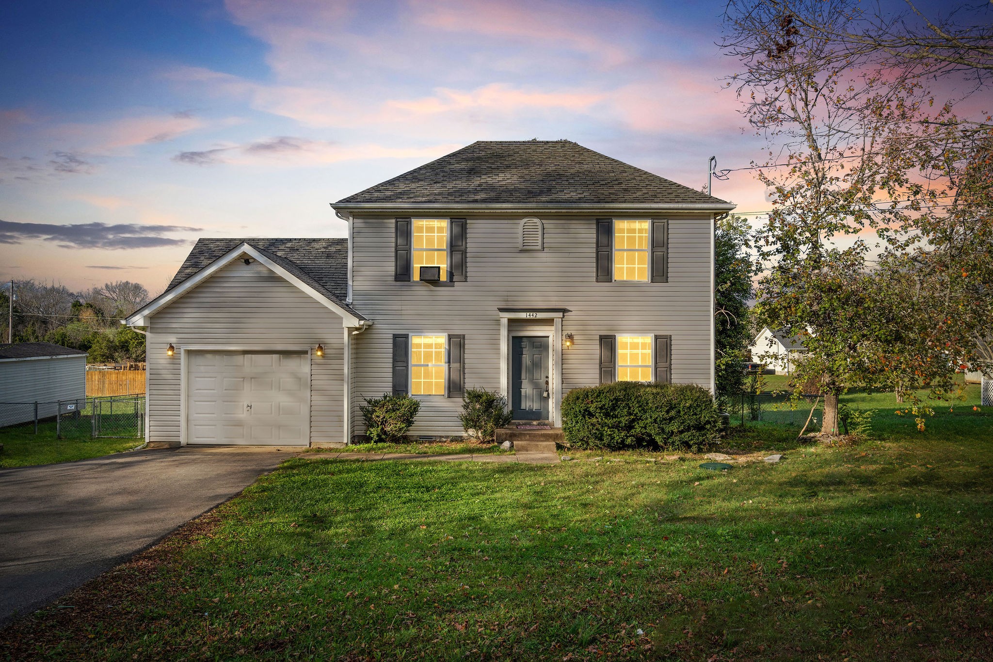 a front view of a house with a yard