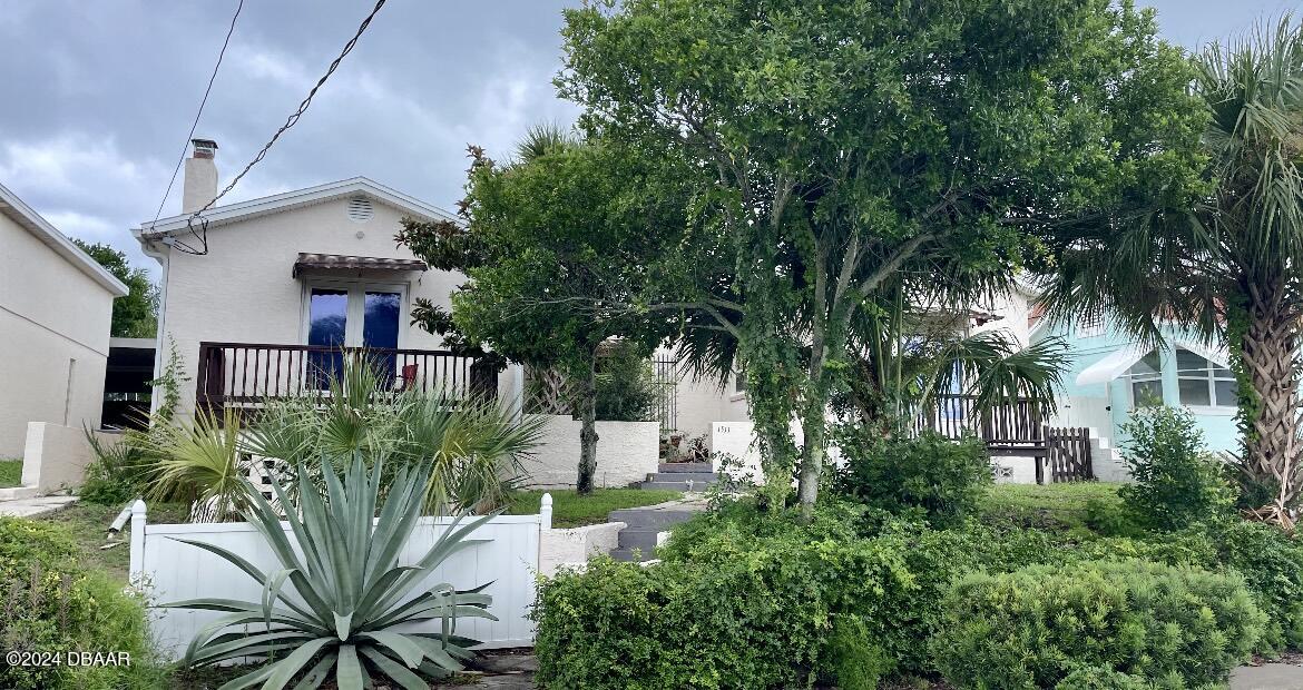 a view of a house with a tree