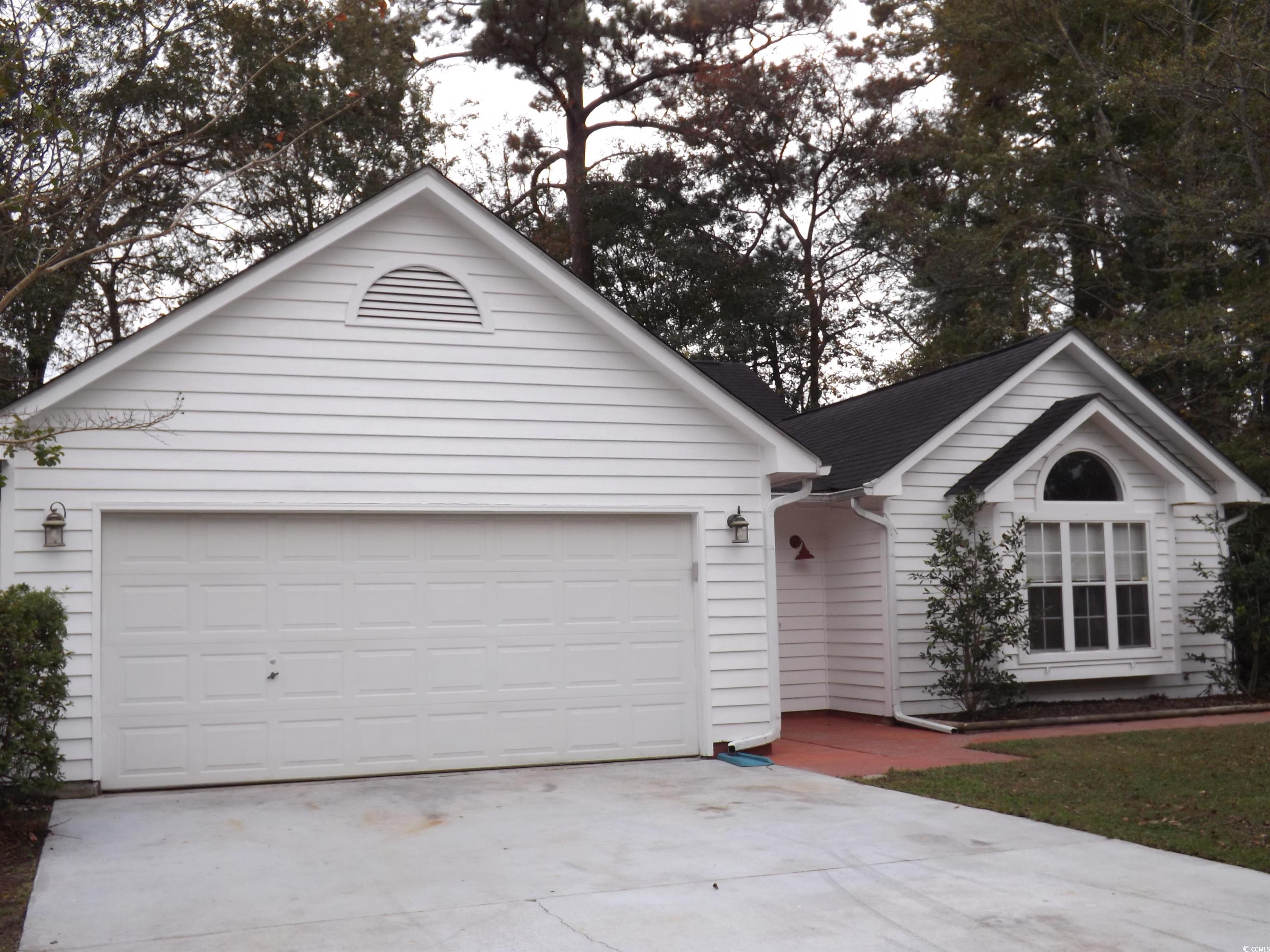 Ranch-style home featuring a garage