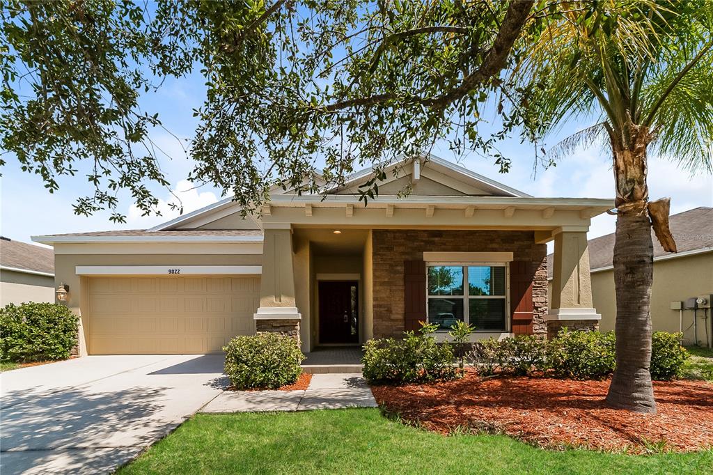 front view of a house with a yard