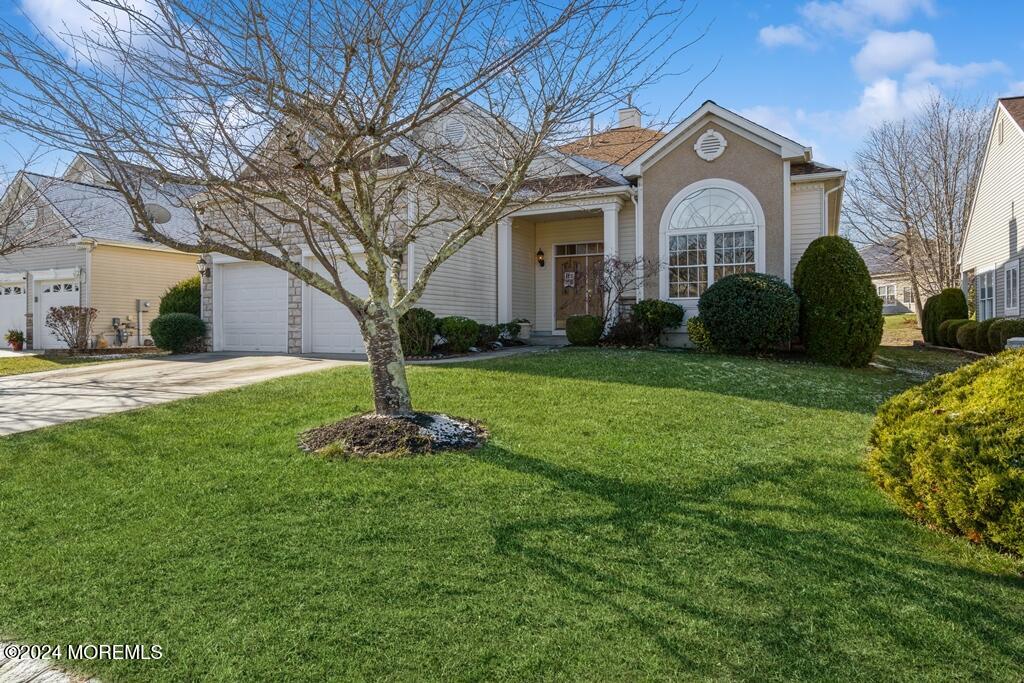 a front view of a house with a yard