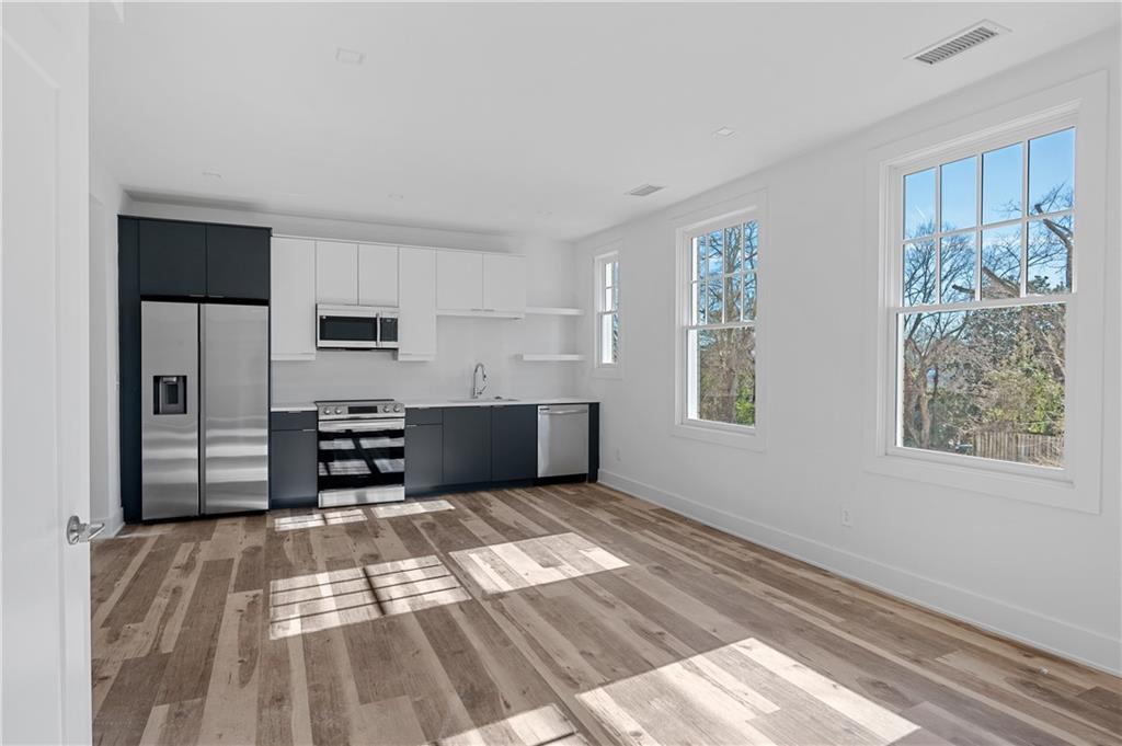 a view of kitchen with furniture and window