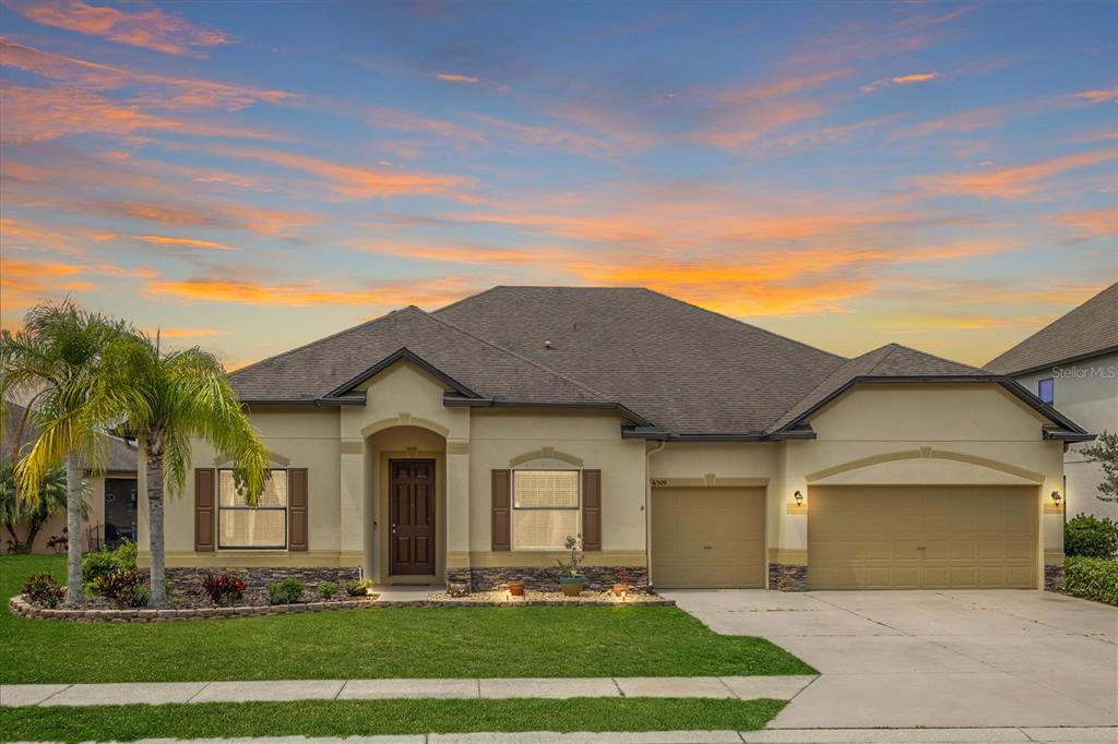 front view of a house with a yard