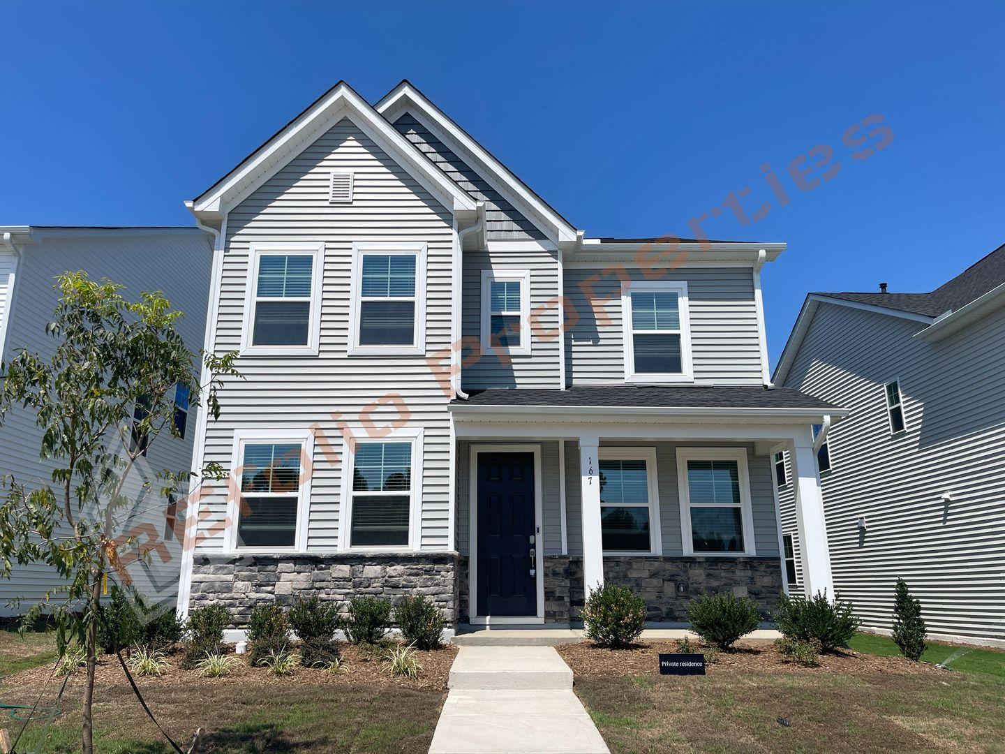 a front view of a house with yard