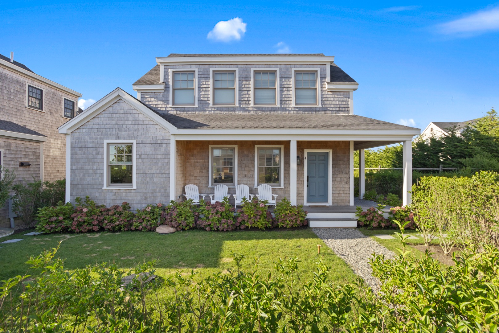 front view of a house with a yard