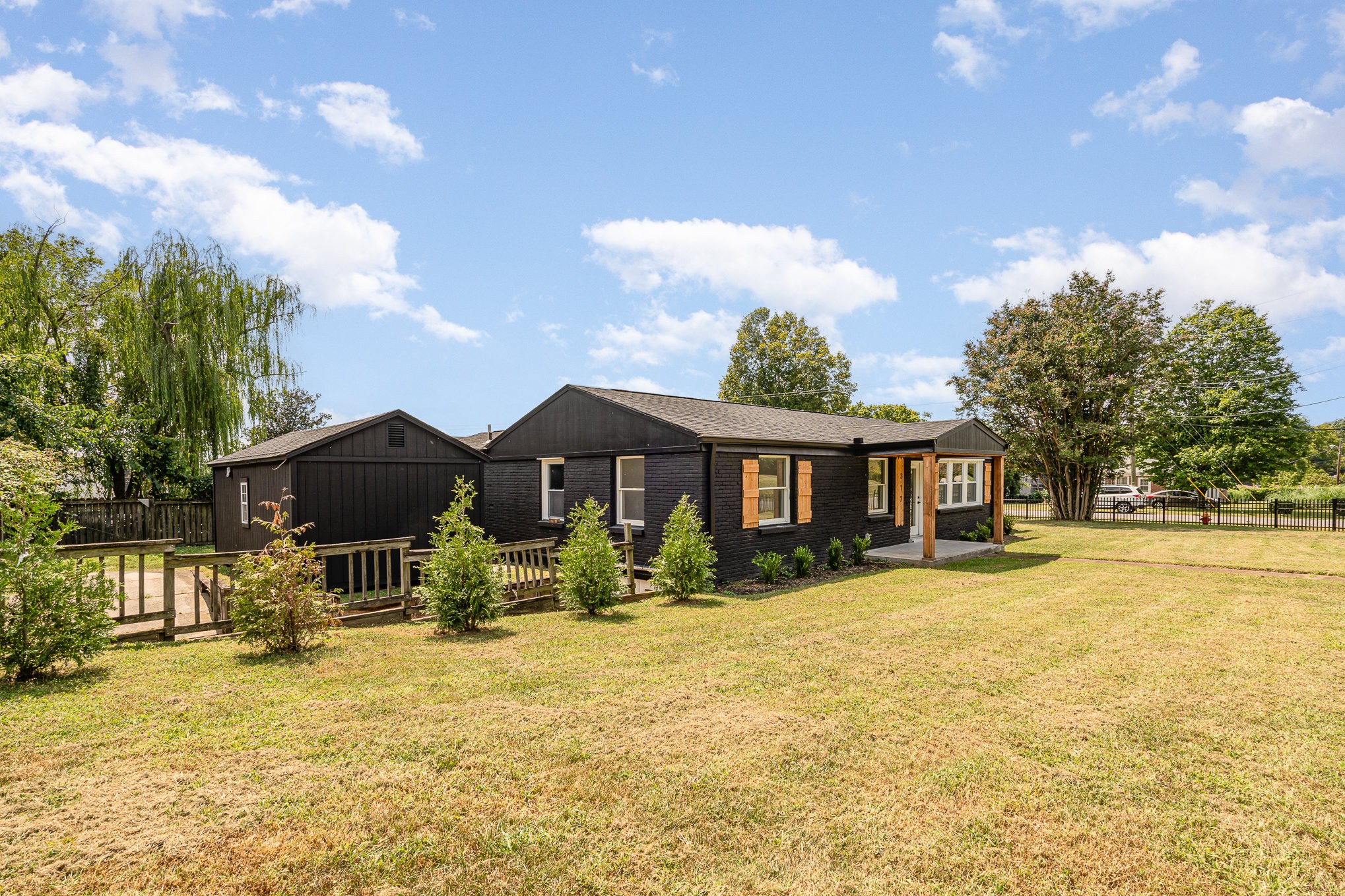 a front view of a house with a yard