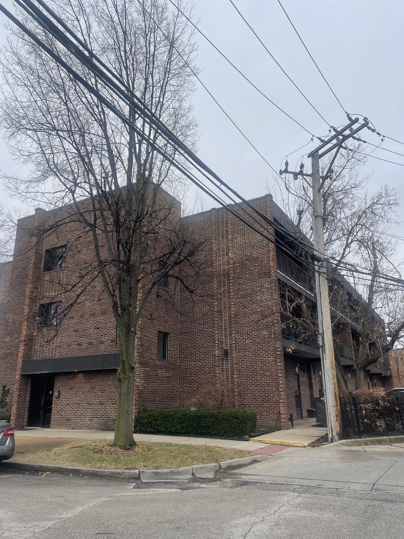 a front view of a building with a road