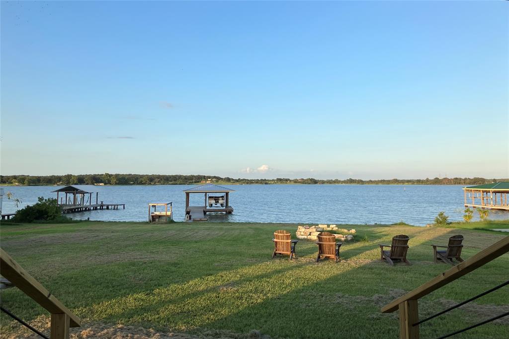 a view of a lake with houses with yard