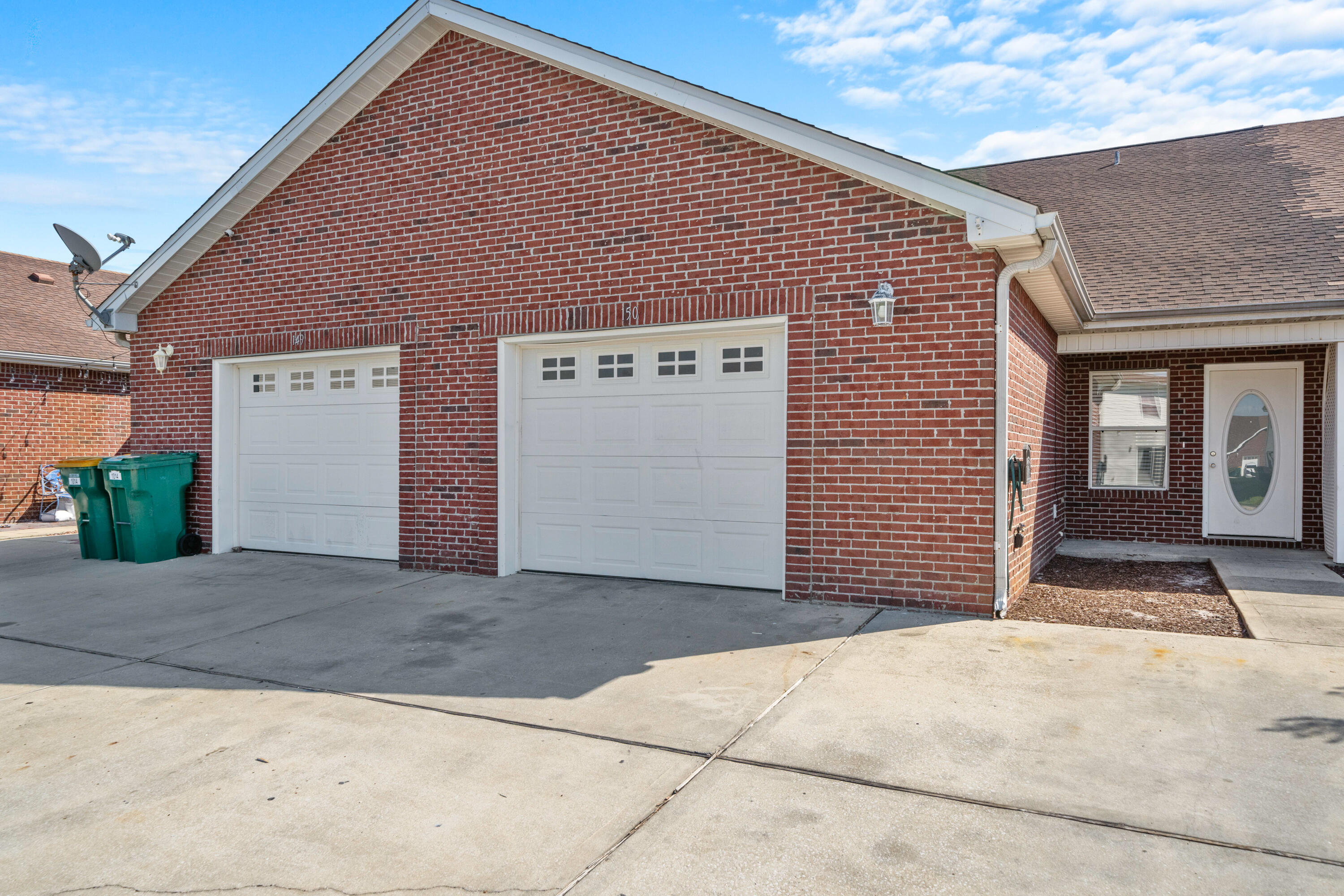 a front view of a house with a garage