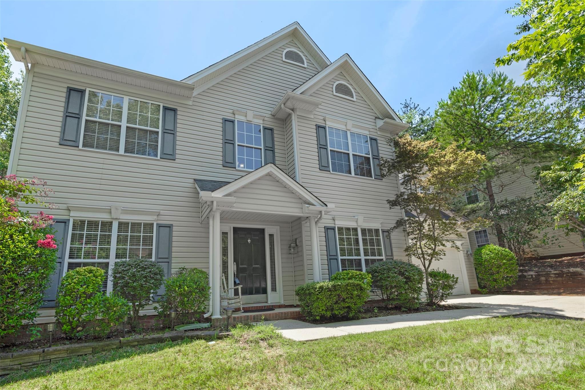 front view of a house with a yard